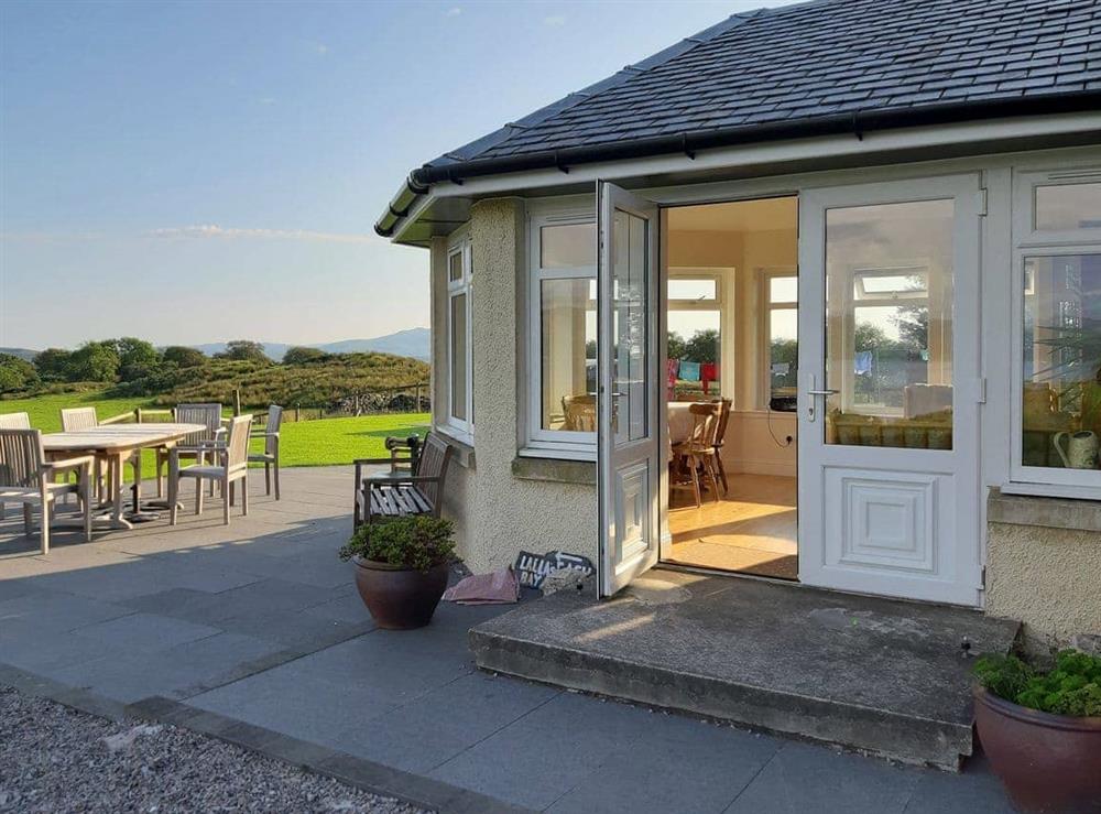 Paved patio with access from the conservatory at Degnish Farmhouse in Kilmelford, nr.Oban, Argyll
