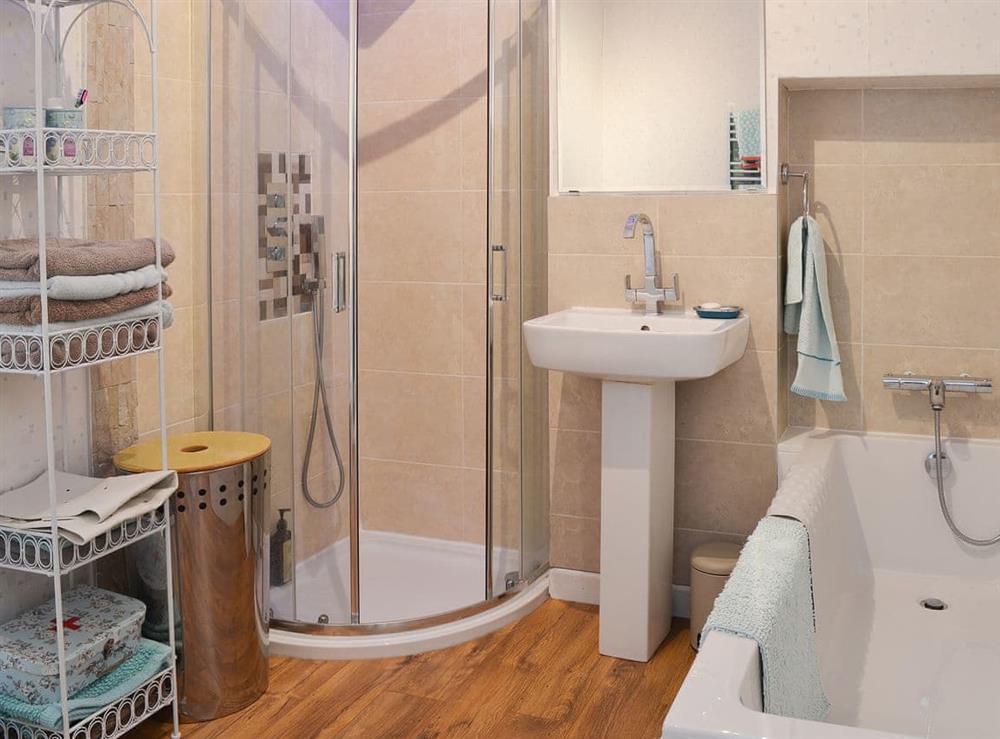 Bathroom with shower cubicle and shower attachment at Deja Blue in Filey, North Yorkshire