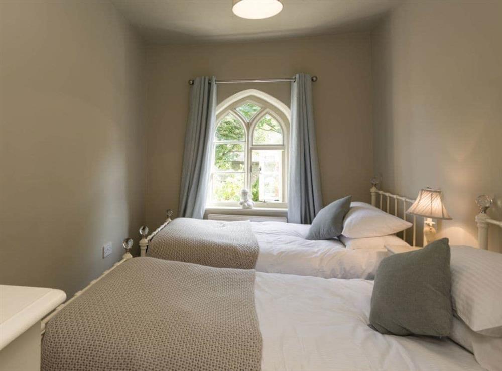 Charming bedroom with twin beds at Dell Cottage in Mundesley, near North Walsham, Norfolk