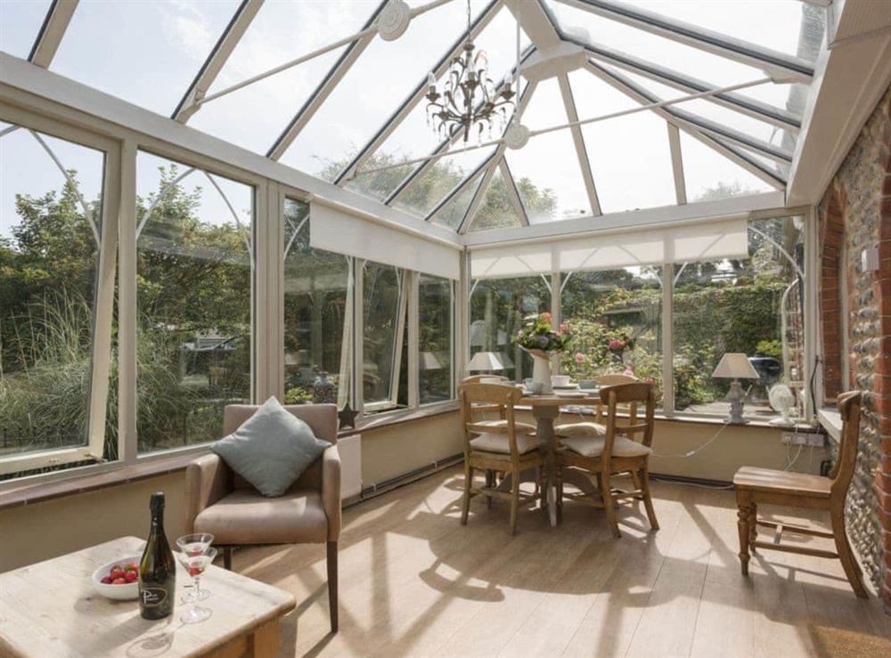 Light and airy conservatory overlooking the garden at Dell Cottage in Mundesley, near North Walsham, Norfolk