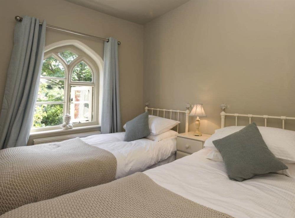 Tranquil bedroom with twin beds at Dell Cottage in Mundesley, near North Walsham, Norfolk