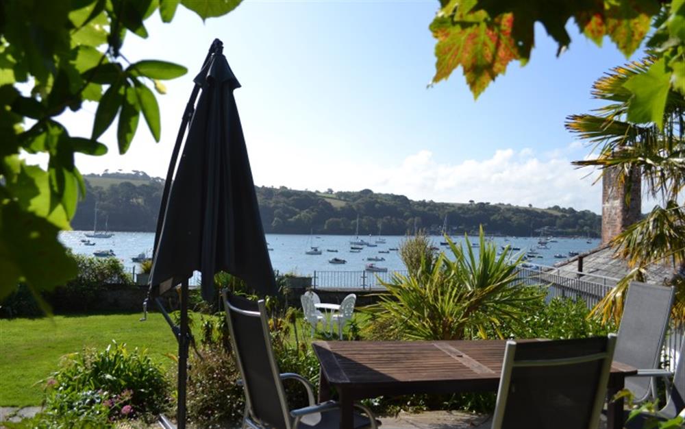 Your own private patio area with kiwi fruit and grapes growing on the gazebo. at Demelza 1 in Helford Passage