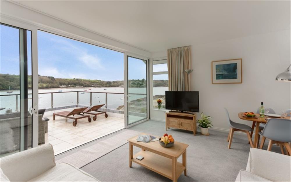 The living room opens onto the balcony for those wonderful views! at Demelza 3 in Helford Passage
