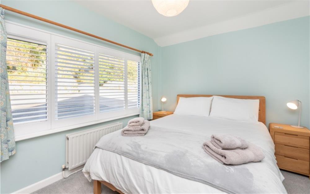 The master bedroom is bright and spacious. at Demelza 3 in Helford Passage