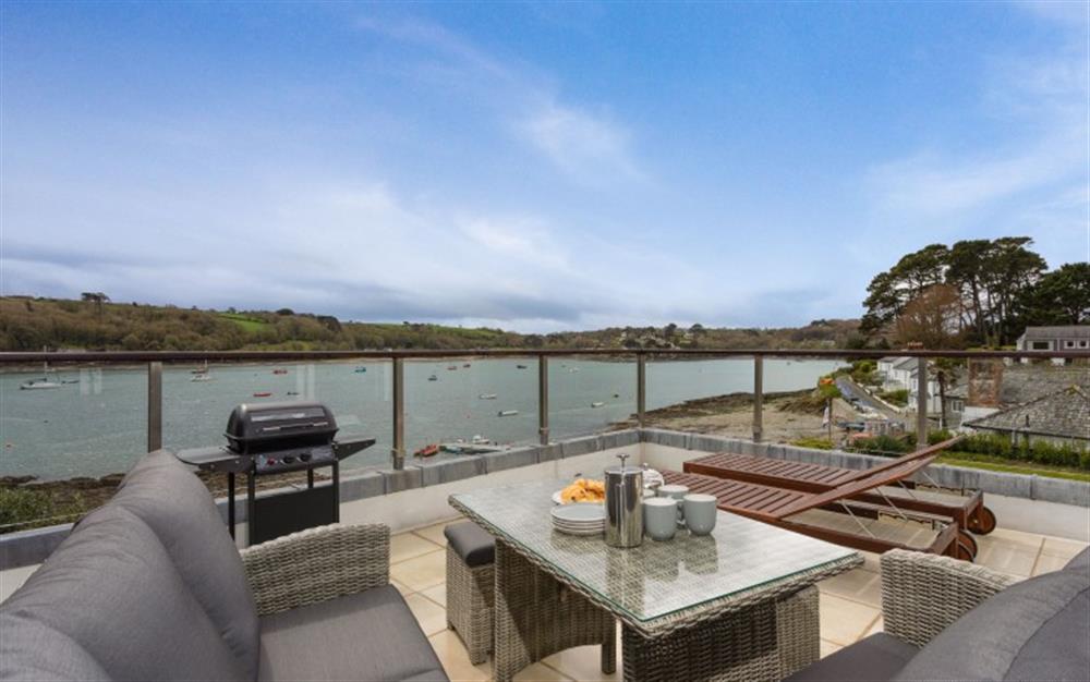 You'll love the balcony with its barbecue and comfy patio furniture! at Demelza 3 in Helford Passage
