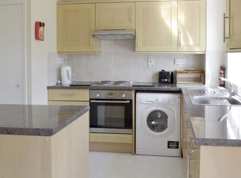Well-equipped fitted kitchen at Dene Corner in Chillington, Devon