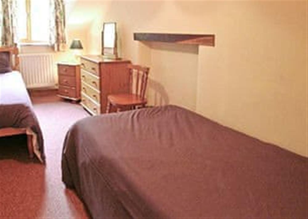 Twin bedroom at Denhill Cottage in Chipstable, near Taunton, Somerset