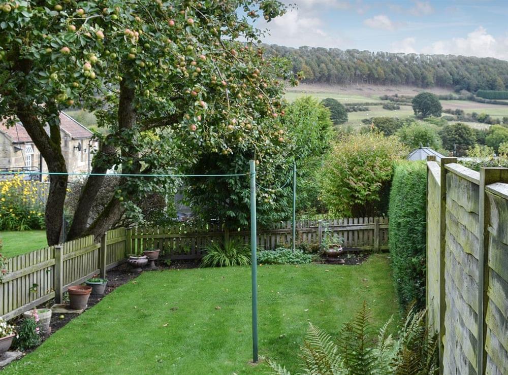 Enclosed rear garden with wonderful surrounding countryside at Derwent Cottage in Wrench Green, near Scarborough, North Yorkshire