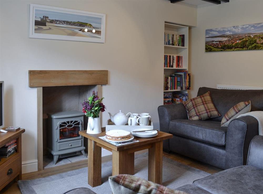 Welcoming, cosy living room at Derwent Cottage in Wrench Green, near Scarborough, North Yorkshire