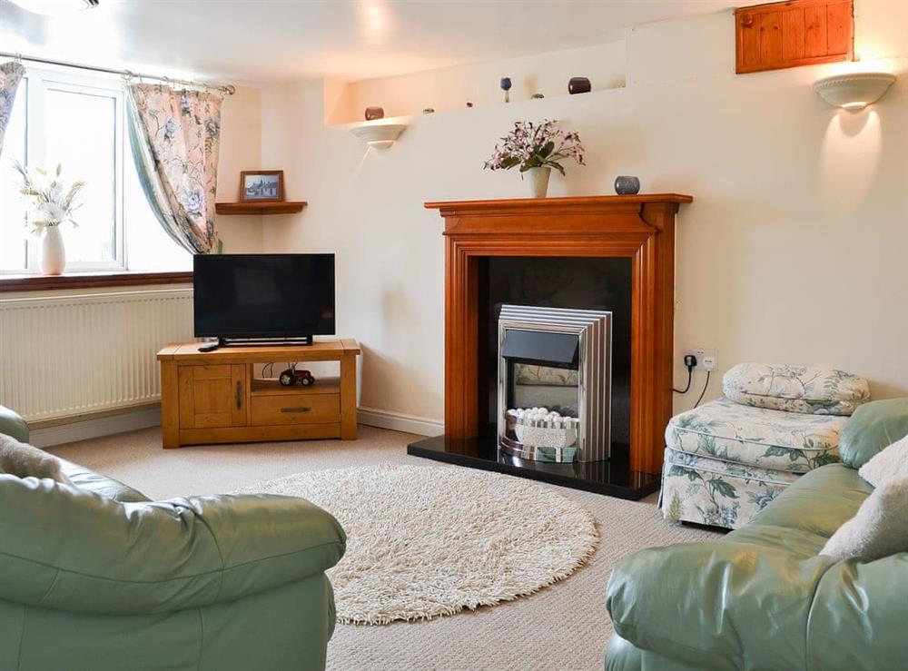 Warm and welcoming living room at Deuglawdd Cottage in Aberdaron, near Pwllheli, Gwynedd