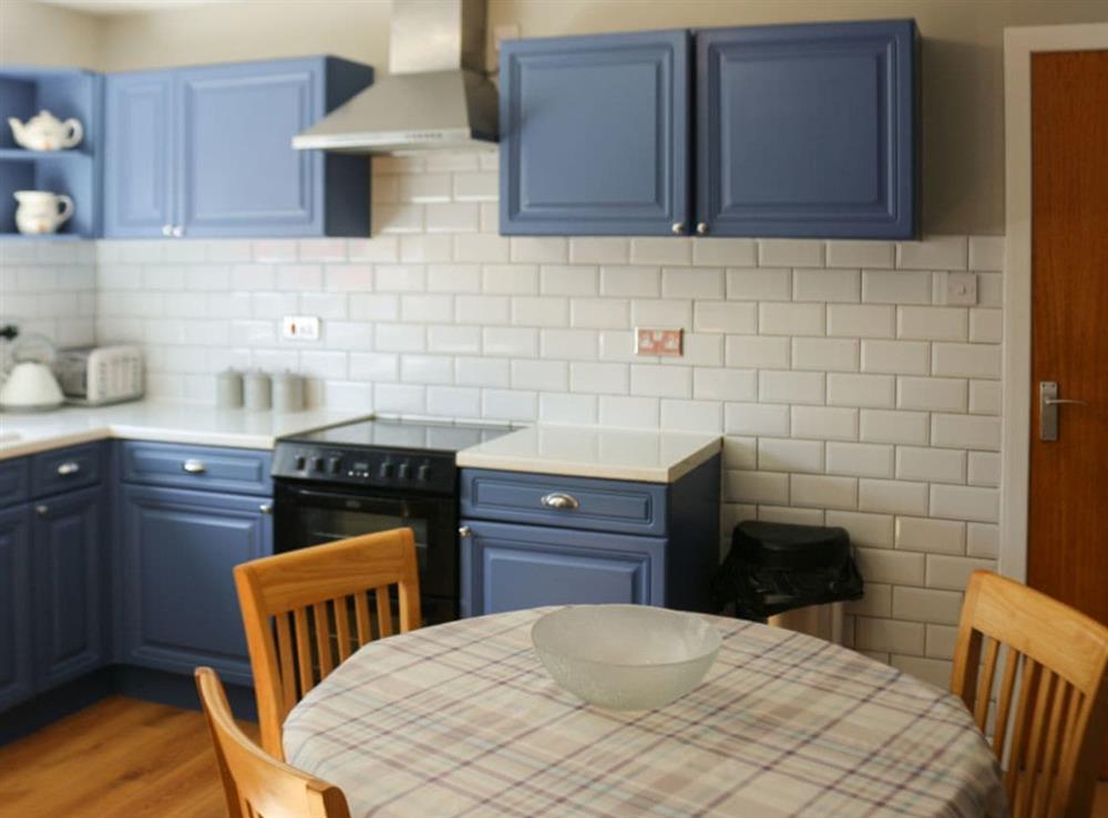 Well-equipped kitchen with dining area at Devana Croft in Tarbert, Agyll and Bute, Argyll