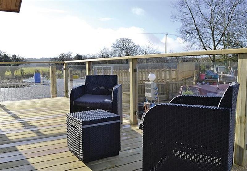 The veranda in Waters Edge at Devizes Marina Lodges in Devizes, Wiltshire