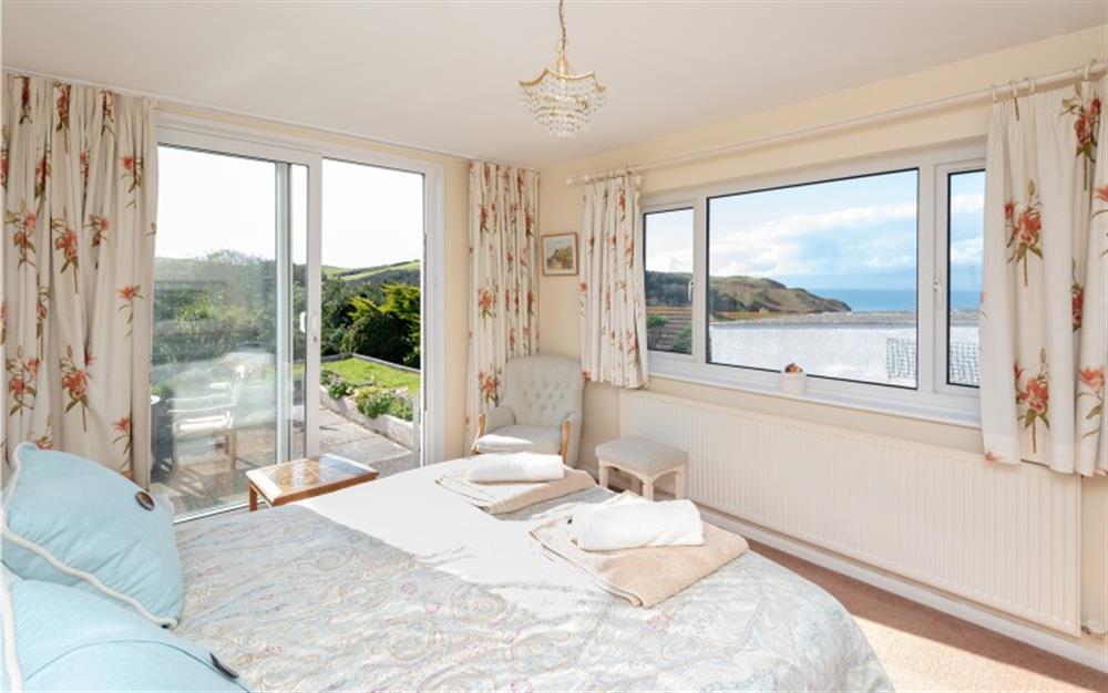 The master bedroom with double bed at Devon House in Hope Cove
