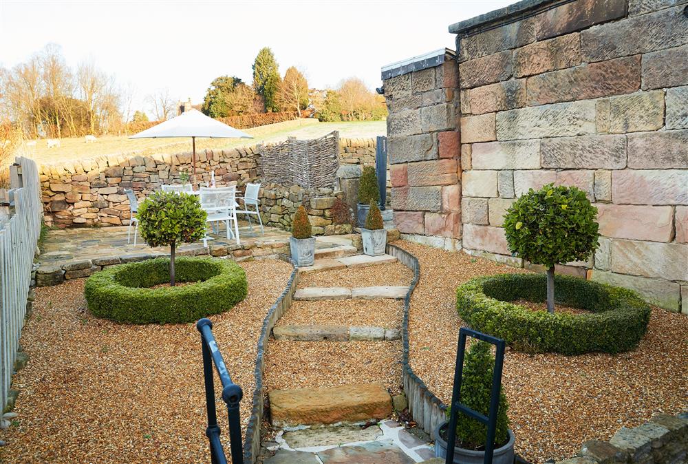 Beautifully landscaped garden with views over the Chatsworth Estate at Devonshire Cottage, Chatsworth Estate , Beeley 