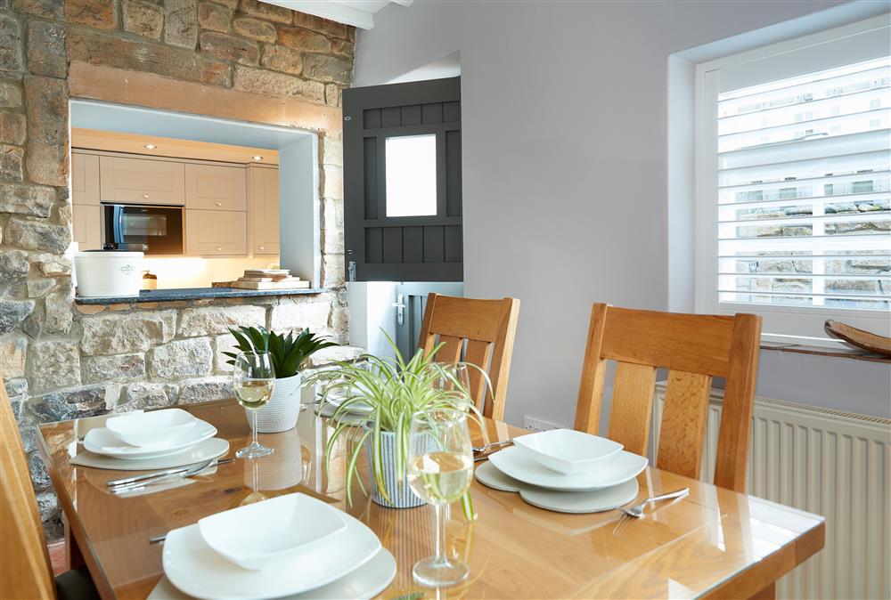 Spacious dining room with serving hatch to kitchen at Devonshire Cottage, Chatsworth Estate , Beeley 