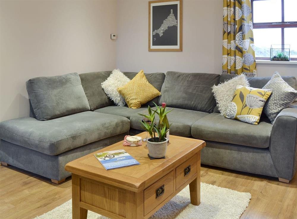 Comfy seating in the living area at Dew Cottage in St Buryan, near Sennen, Cornwall