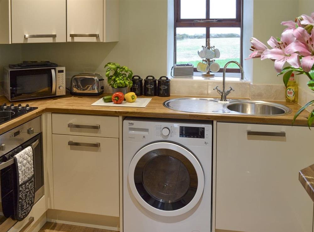 Well-equipped fitted kitchen at Dew Cottage in St Buryan, near Sennen, Cornwall