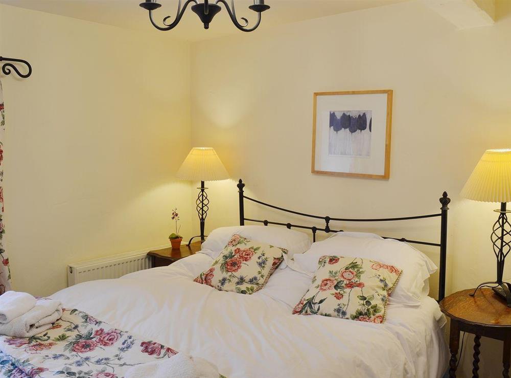 Romantic 5ft bed in room with floral theme and chandelier at Dewsnaps Frost in Chinley, Nr Chapel-en-le-Frith., Derbyshire