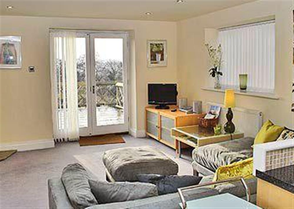 The living area, with gas ’woodburner’, opens up on to the patio at Dewsnaps Spring in Chinley, High Peak, Derbyshire., Great Britain