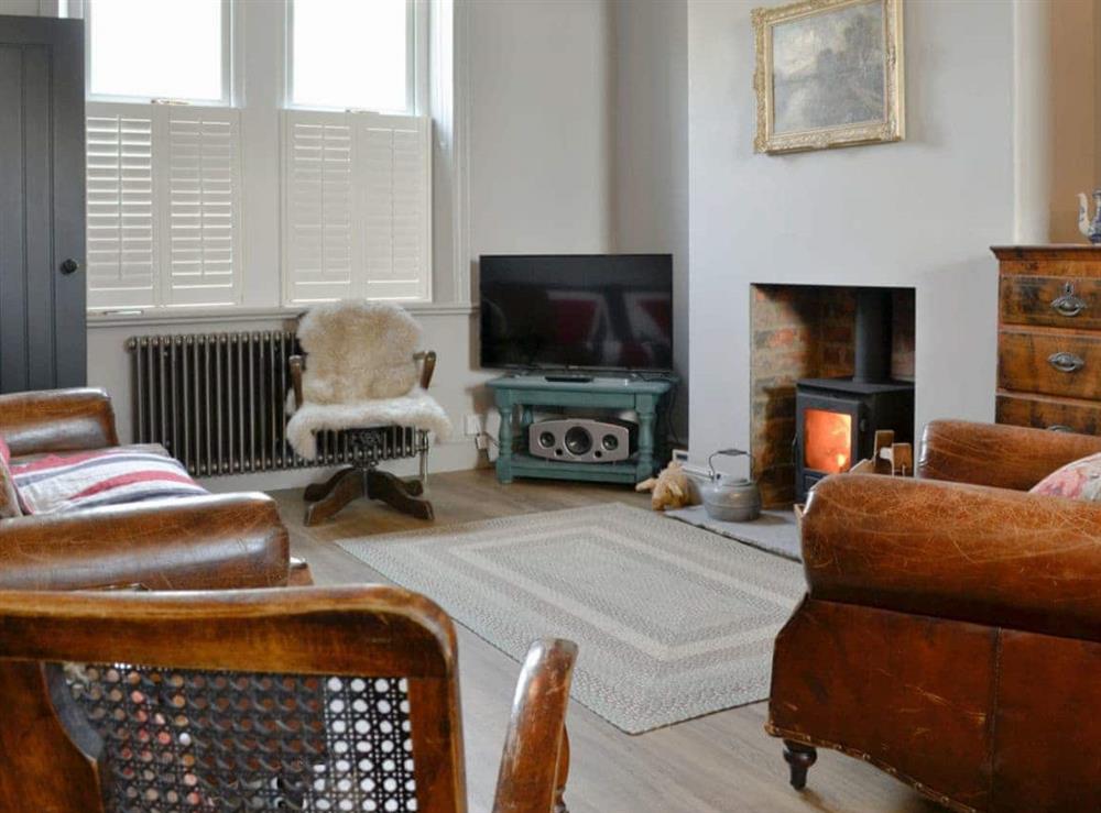Charming living area with cosy wood burner at Dick n Liddys Cottage in Gargrave, near Skipton, North Yorkshire