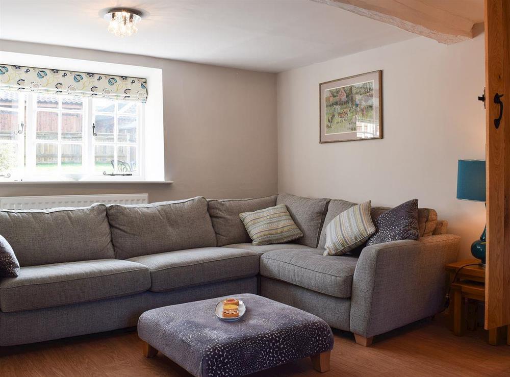 Living room with large corner suite at Dicks Cottage in Cottesmore, near Oakham, Rutland, Norfolk