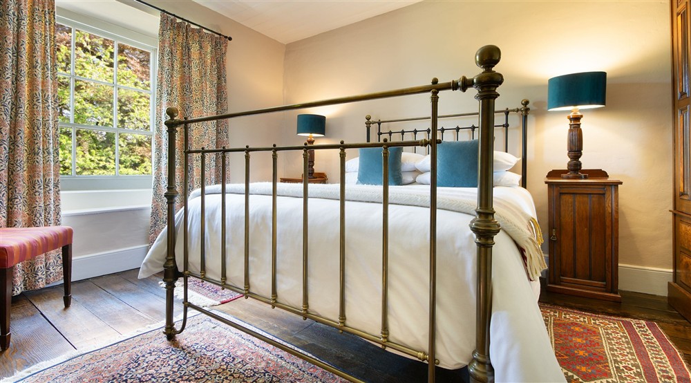 The first-floor double bedroom at Dinefwr Home Farm in Llandeilo, Carmarthenshire