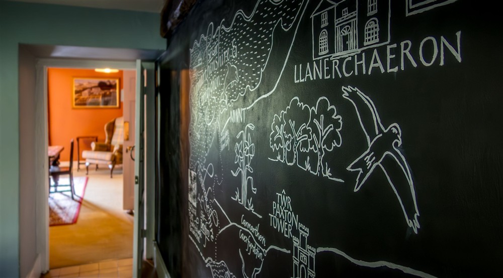 The illustrated wall in the kitchen at Dinefwr Home Farm in Llandeilo, Carmarthenshire