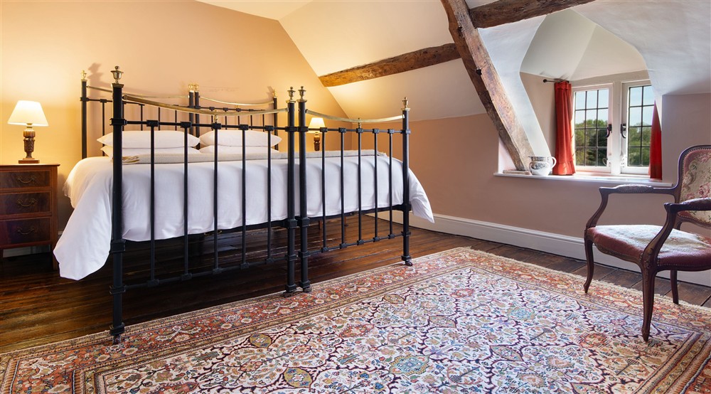 The second-floor, double bedroom (with a super king-sized bed which can be a twin on request) at Dinefwr Home Farm in Llandeilo, Carmarthenshire