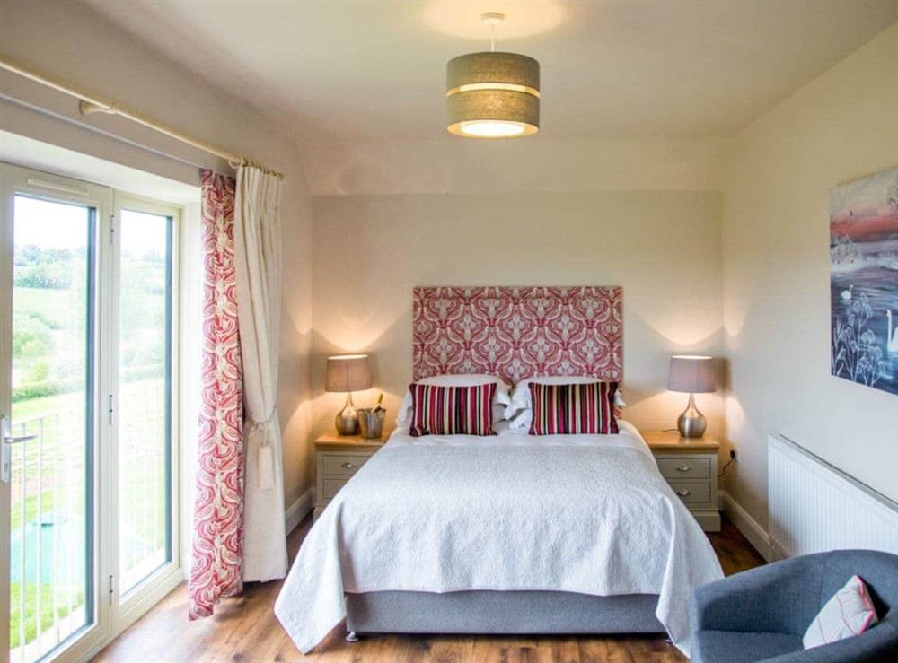 Comfortable double bedroom with Juliet balcony at The Rookery, 