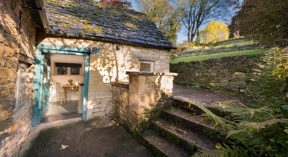 The pretty exterior and entrance of Diston's Cottage, Snowshill, Gloucestershire