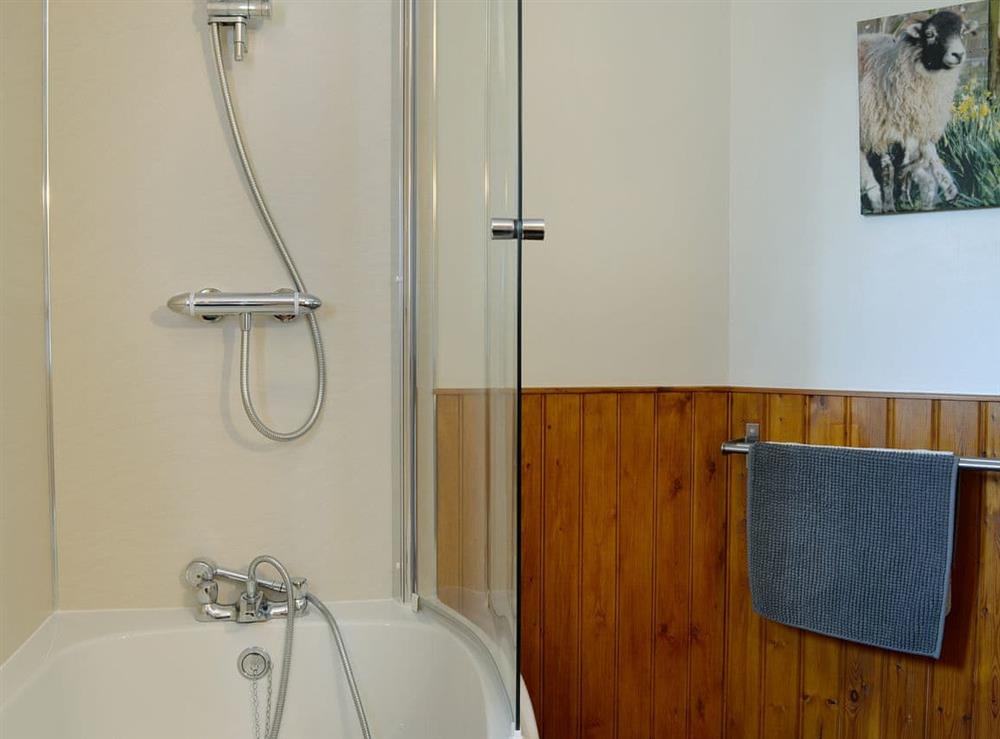 Bathroom with shower over bath at Derwent Dale Cottage, 