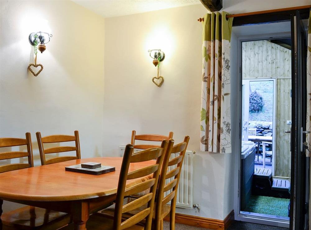 Charming dining room with patio access at Derwent Dale Cottage, 
