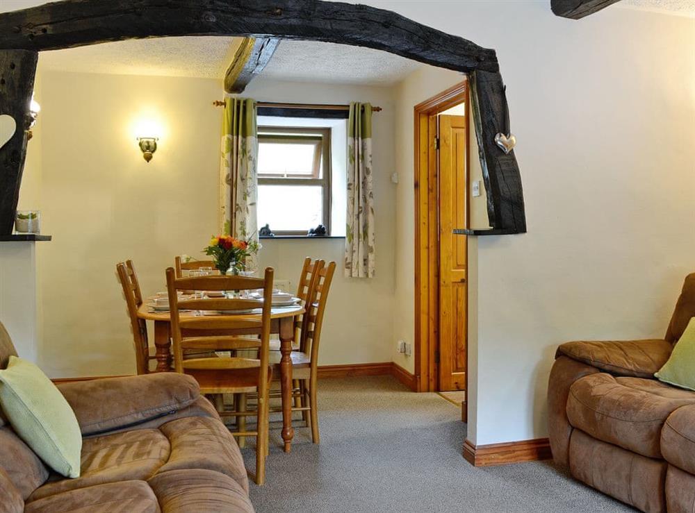 Homely living/dining room with beams at Derwent Dale Cottage, 