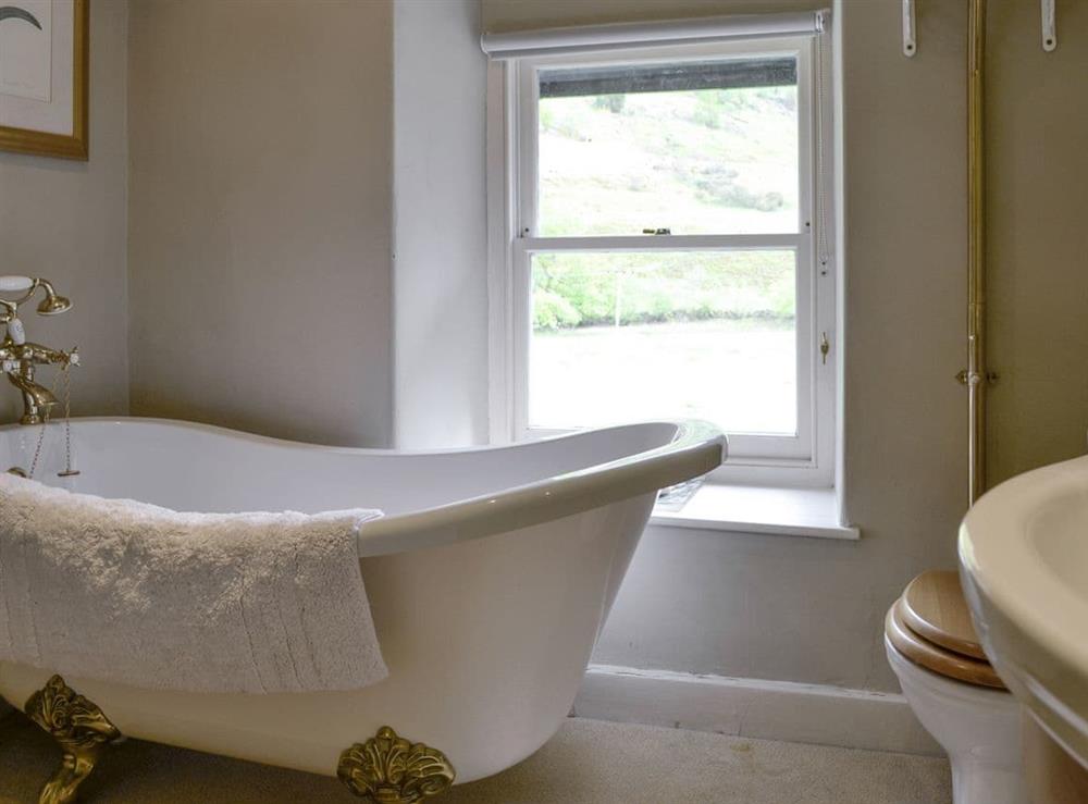 Bathroom with roll-top bath at Dol Y Clochydd in Llanfachreth, near Dolgellau, Gwynedd