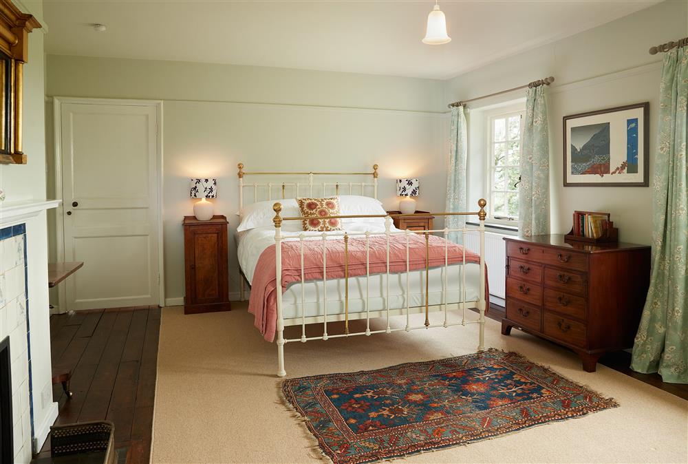 Bedroom one with a 5’ king-size bed at Dolbelidr, Saint Asaph
