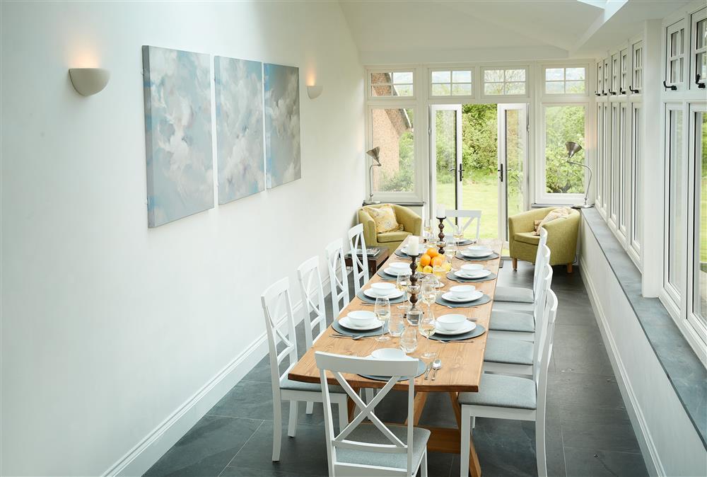 The dining room leads into the garden at Dolbelidr, Saint Asaph