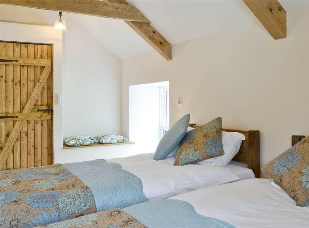 Airy twin bedroom at Stable Cottage, 