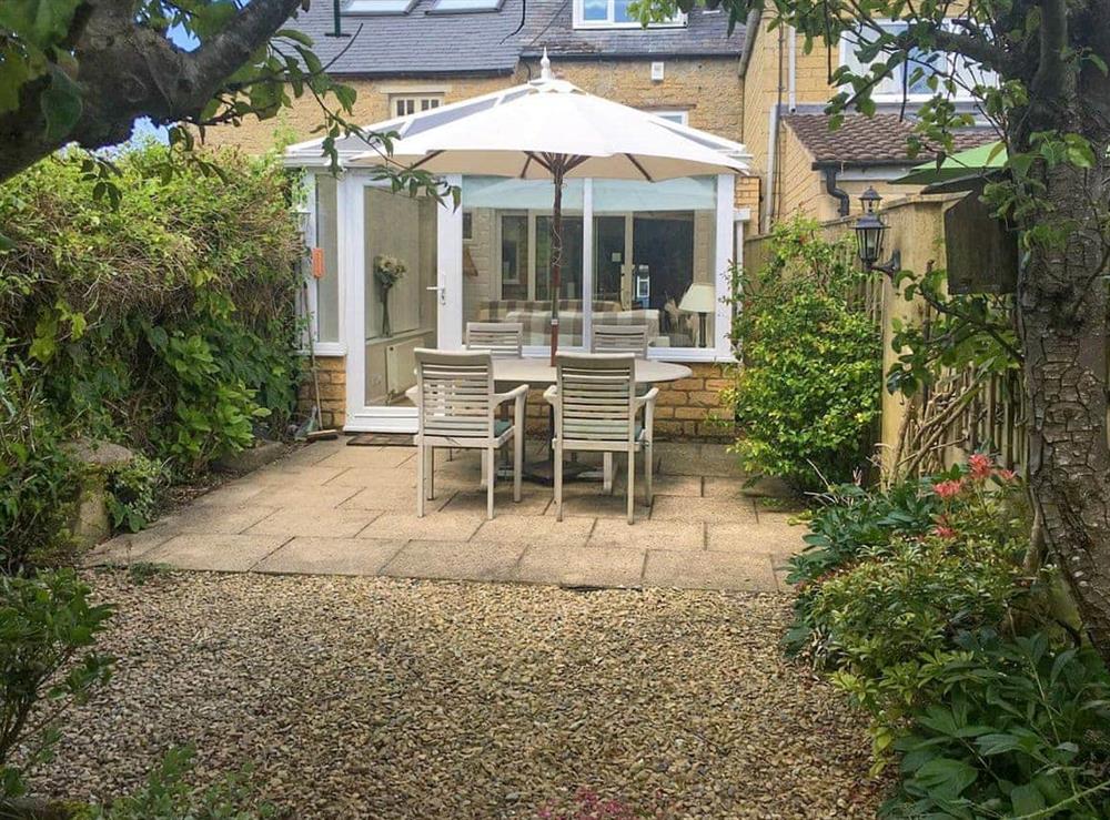 Patio at Dolls Cottage in Bourton-on-the-Water, Gloucestershire