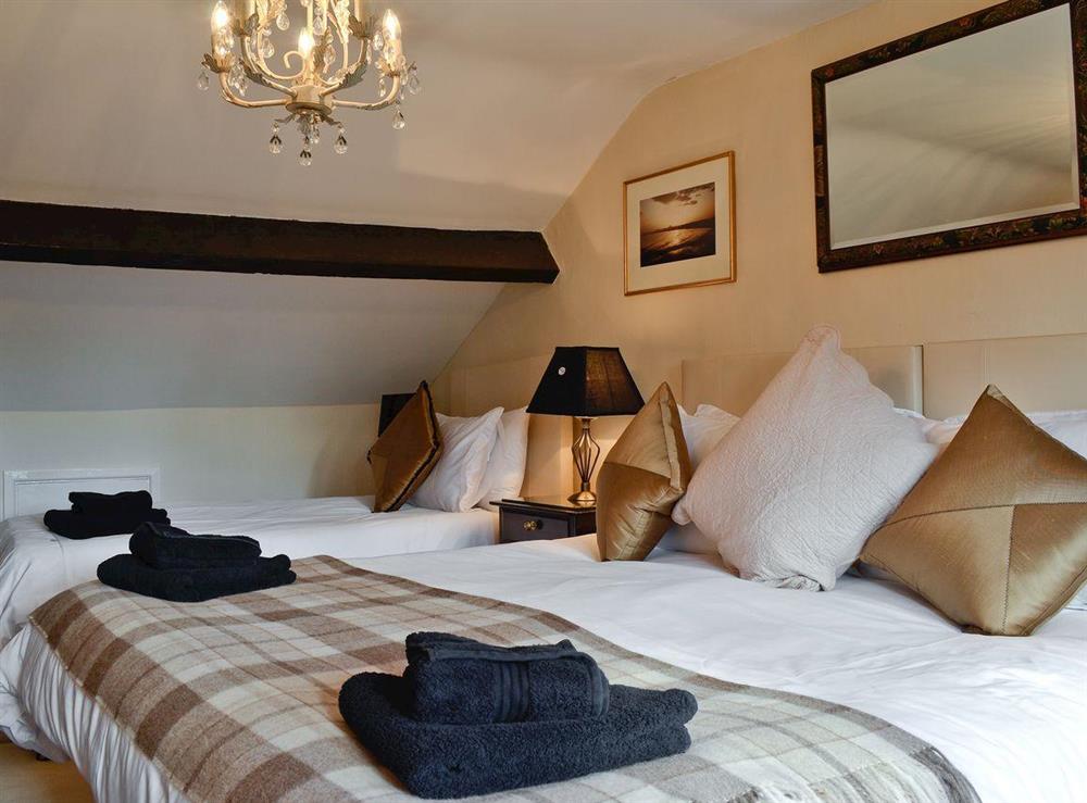 Triple bedroom at Dolls Cottage in Bourton-on-the-Water, Gloucestershire