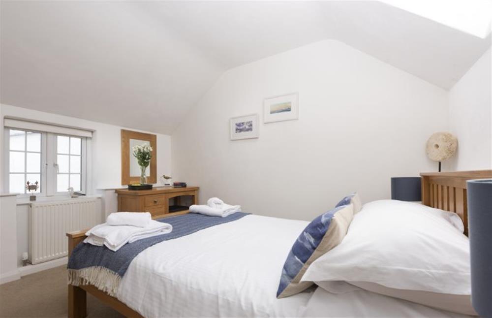 Bedroom three with an en-suite shower room and calming sea views at Dolor Cottage, Coverack
