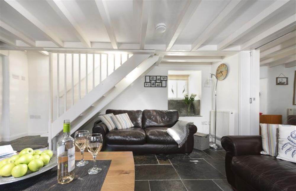 Open-tread stairs from the sitting room lead to the first floor at Dolor Cottage, Coverack