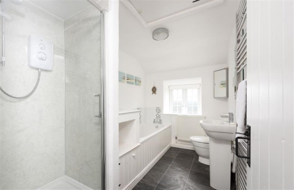 The family bathroom with a bath and a separate walk-in shower at Dolor Cottage, Coverack