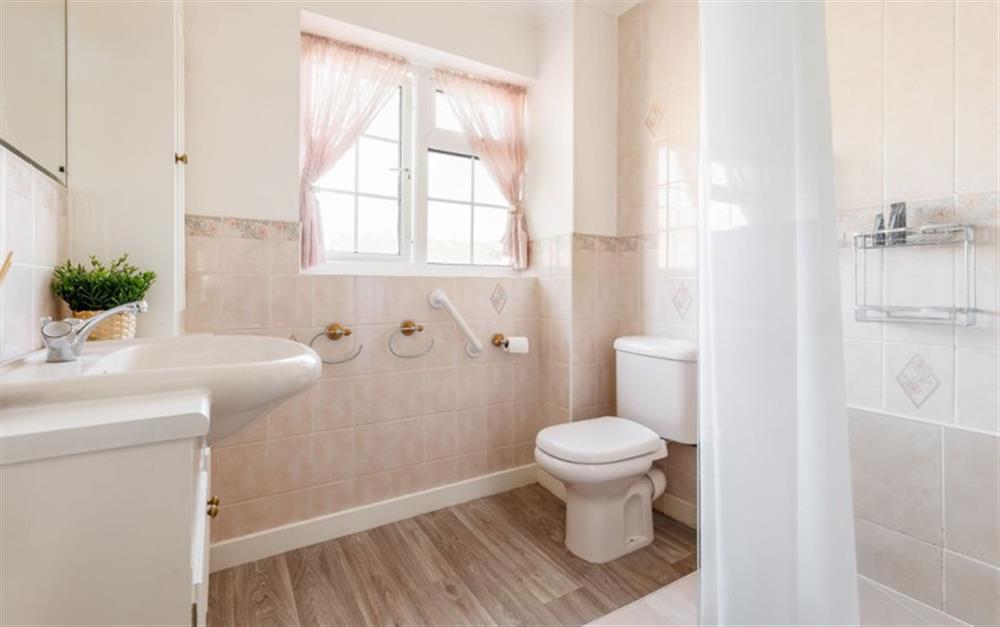 This is the bathroom at Dolphin Cottage in Barton On Sea