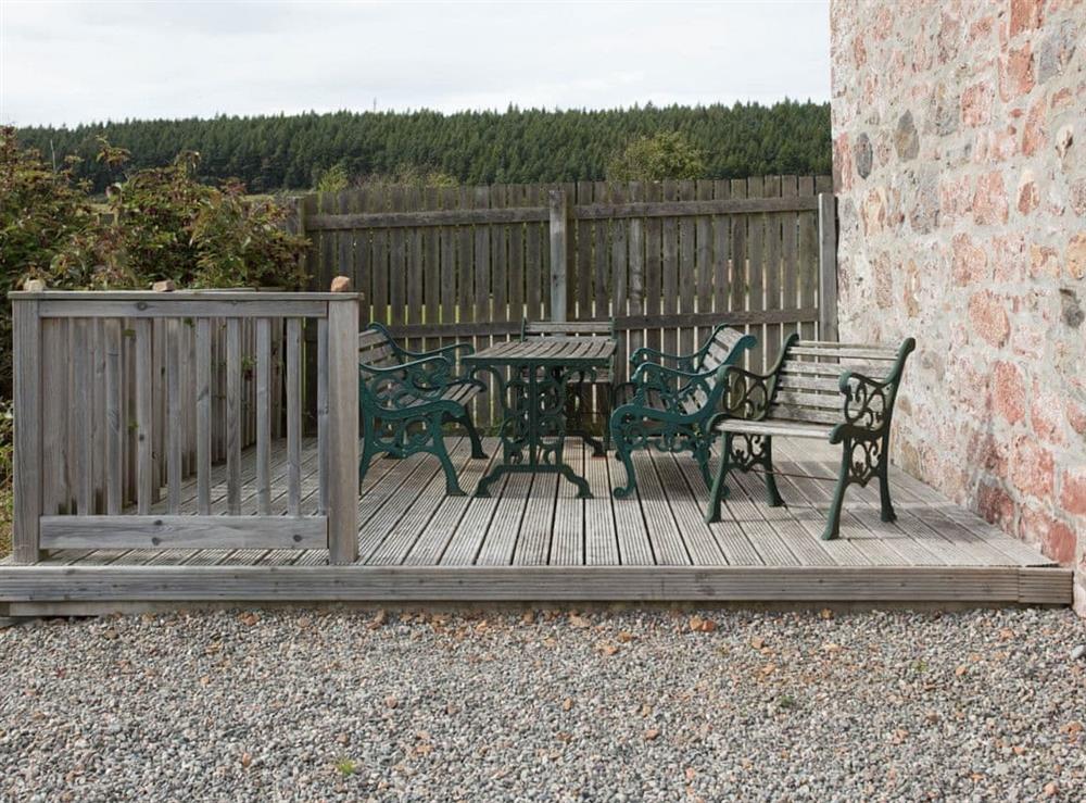 Decked patio area with outdoor furniture at Farmhouse, 