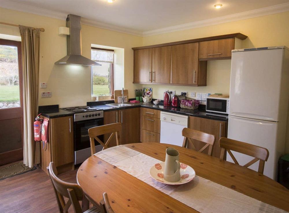 Fully equipped kitchen with dining area at Pines, 