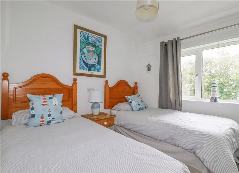 A bedroom in Dolphin Villa at Dolphin Villa, Atlantic Reach near Fraddon