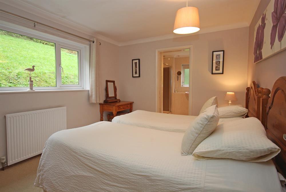 Double bedroom with views over the garden at Dolphins in South Sands, Salcombe