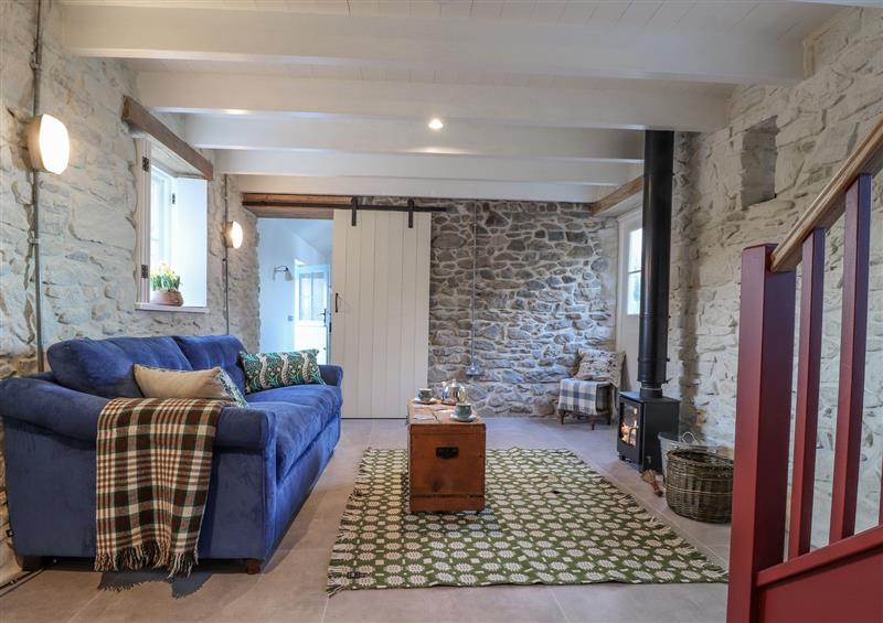Relax in the living area at Dolwylan Barn, Cwmtydu