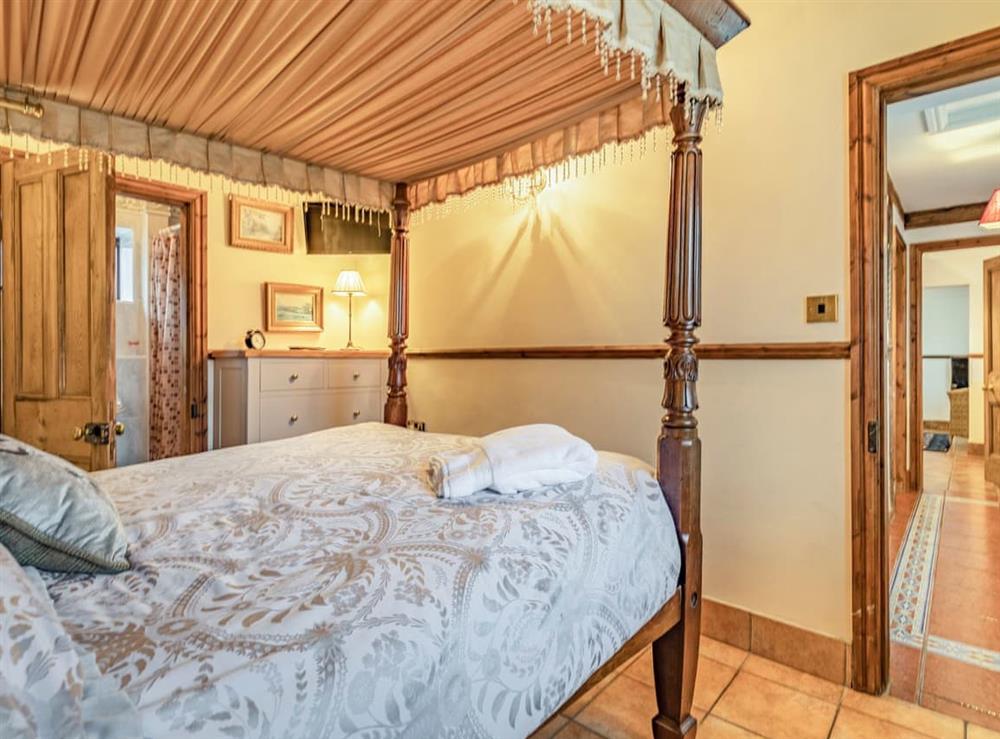 Four Poster bedroom (photo 2) at The Stable, 