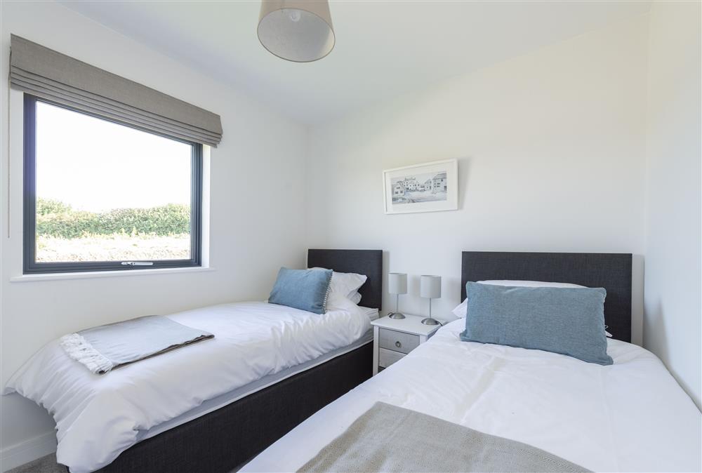 Bedroom three with twin 3’ single beds and en-suite shower room at Dorset Eco Retreats, Ansty, Dorchester